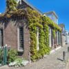 Afbeelding van een groene gevel op een woning in Nederland